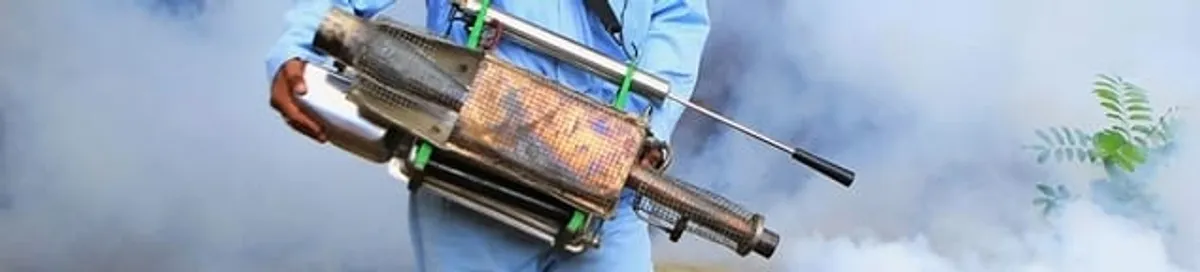 Fumigation technician using a fogger for deep pest treatment in Newark, NJ